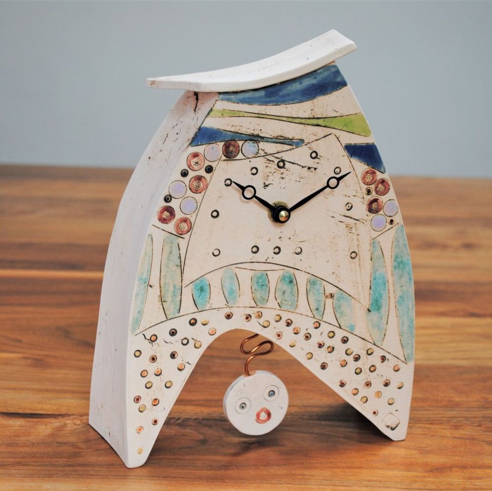 Handmade ceramic mantel clock with pendulum, made form white clay and decor