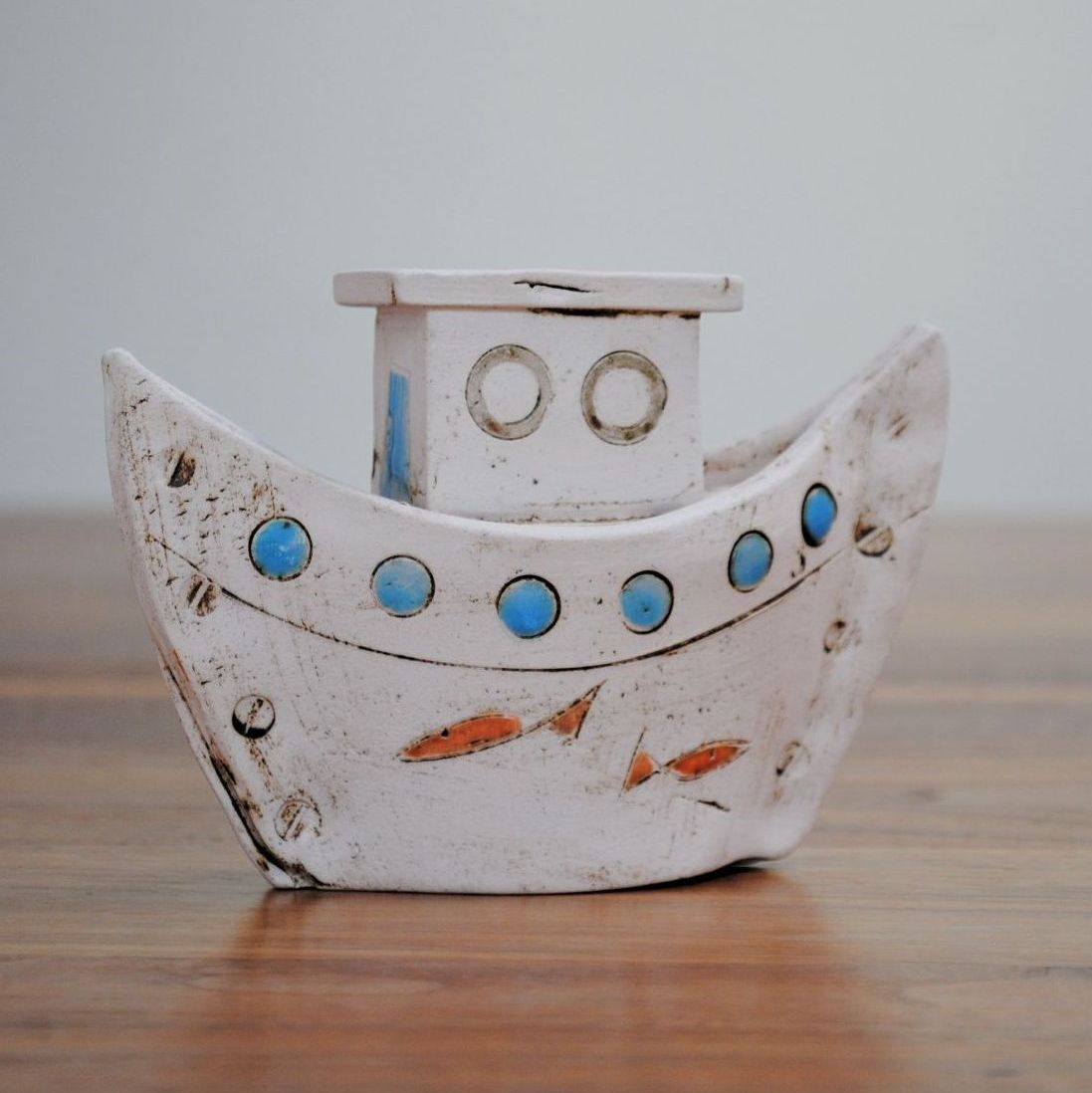 Small boat with blue window