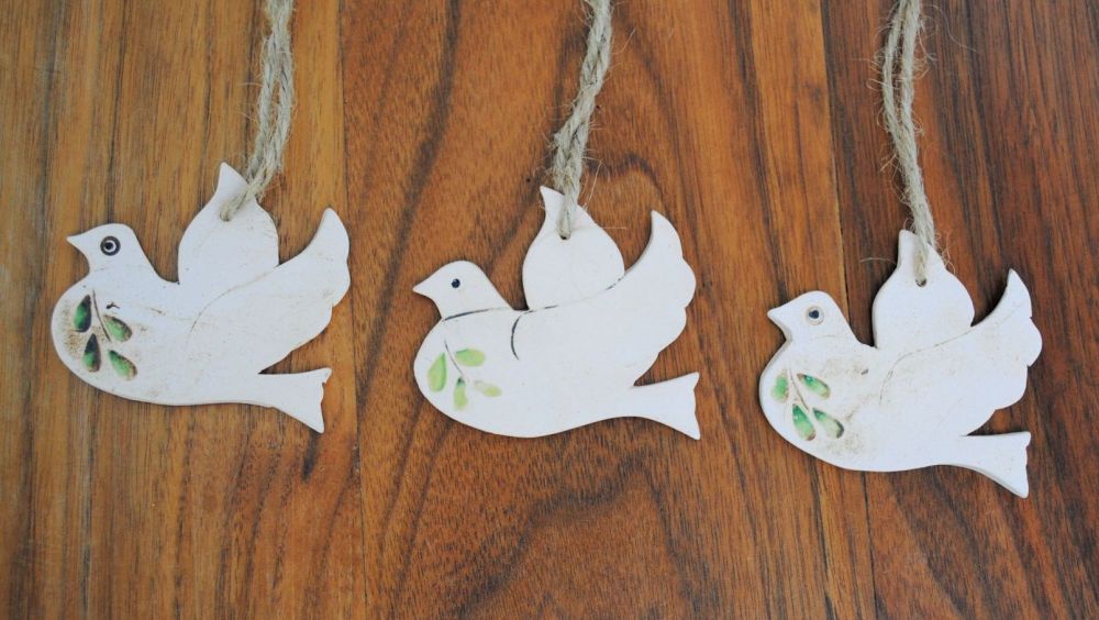 Set of 3 hanging little doves handmade from a white clay and decorated with