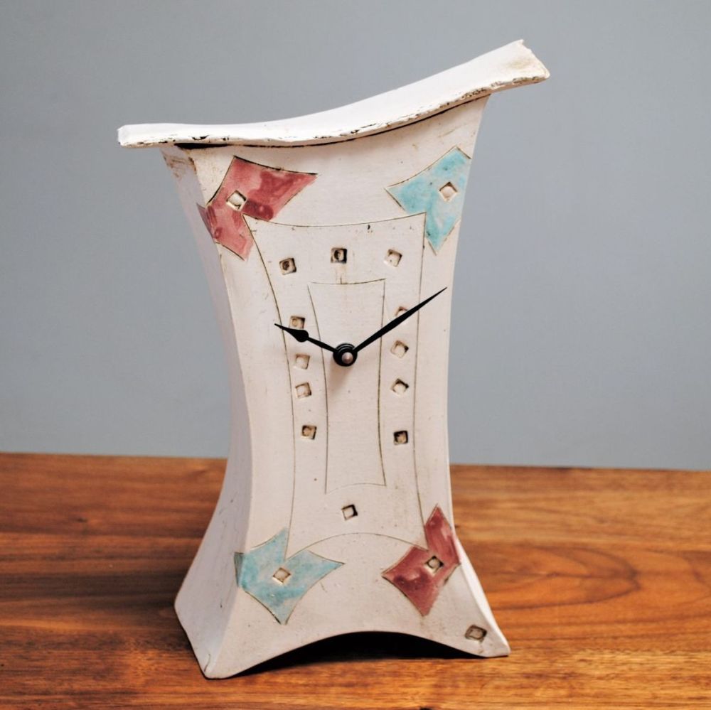 Ceramic mantel clock from white clay with contemporary turquoise and pinky-