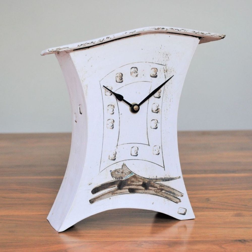 Mantel ceramic clock with a brown jumping  / running dog.
