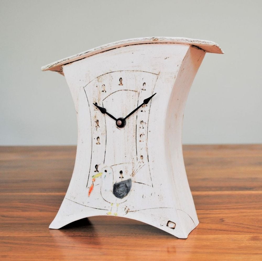 Ceramic clock with nautical design, the seagull and fish.