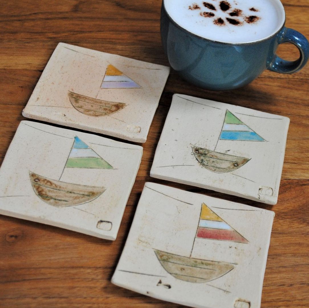 Set of four Coasters  with boat design.