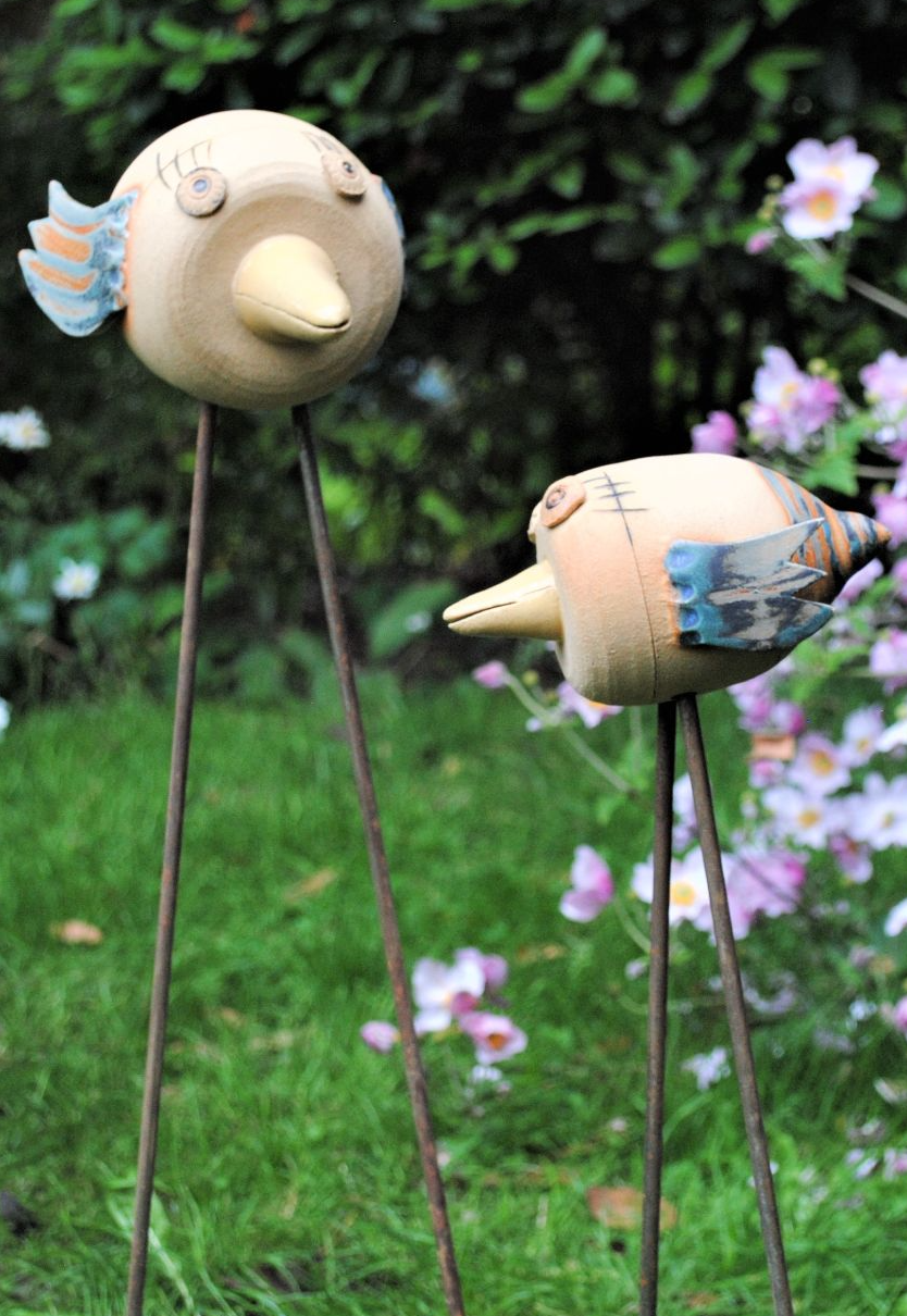 Ceramics for outdoor, including a bird bath, large lantern and garden/pot stakes.