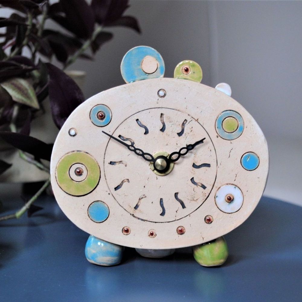 Small bedside table clock, blue, green white, red.