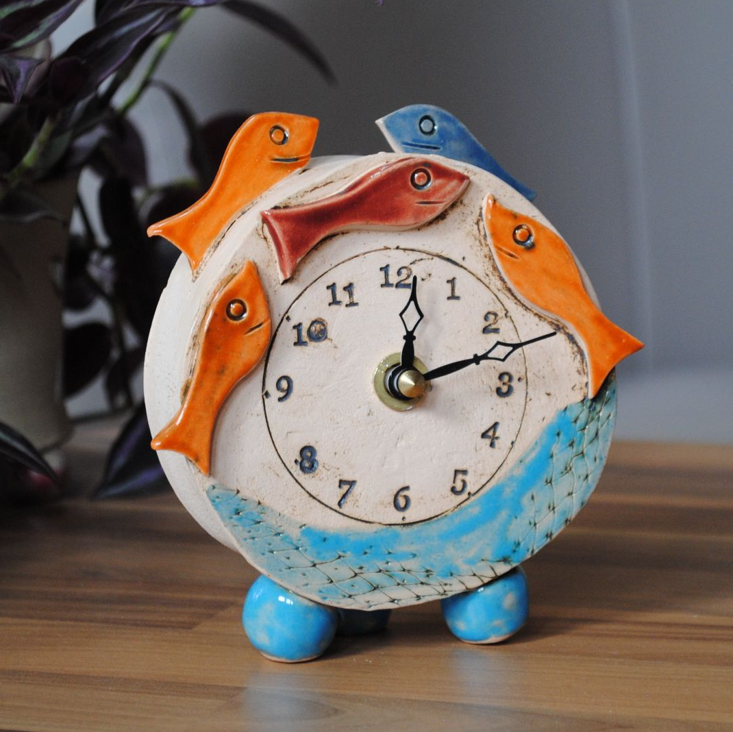 Ceramic small mantel clock with german quartz movement from a white clay and colourful design.
