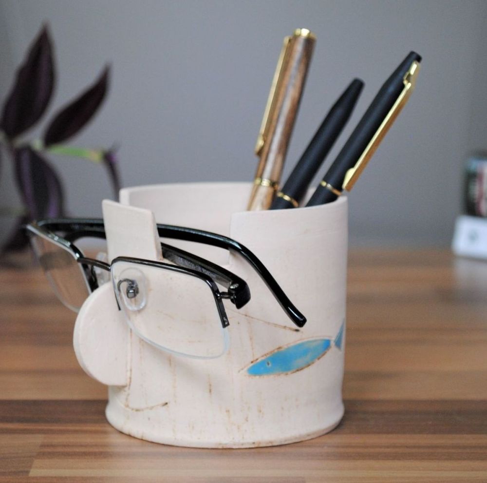 Fish spects stand and pen holder.