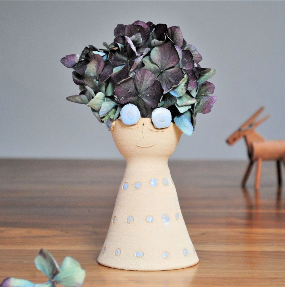 Happy face ceramic vase blue flowers