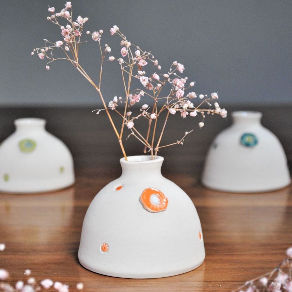 Bud vase with orange detail.