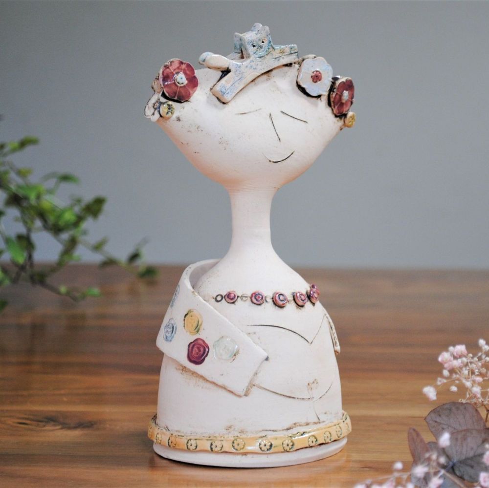 Small lady and cat sculpture thrown on the pottery wheel