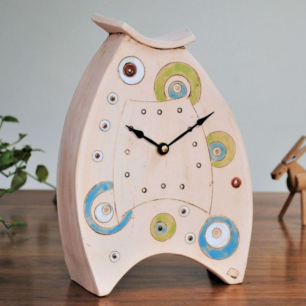 Ceramic mantel clock made from white clay, decoarate with circles and dots
