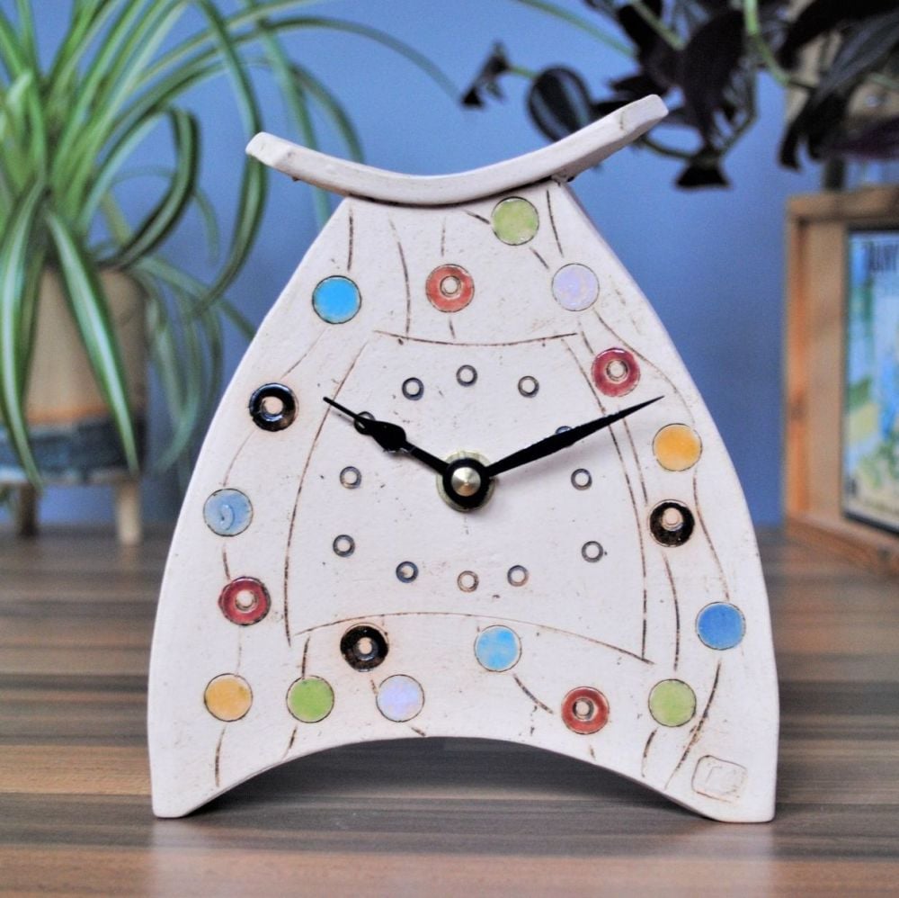 small ceramic handmade clock with dots and spots