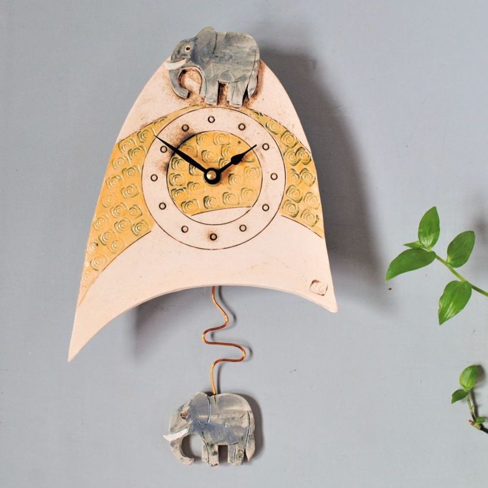 Ceramic pendulum wall clock with elephant