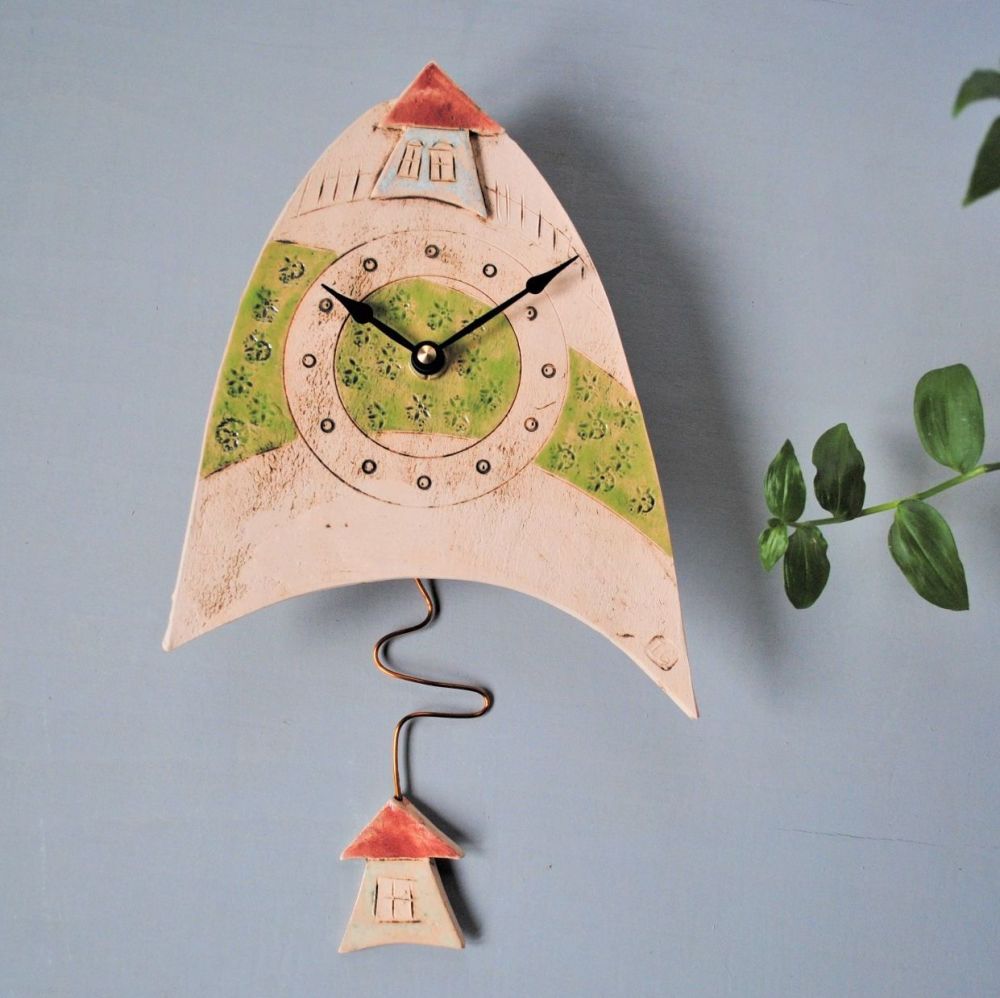 Small Ceramic pendulum wall with house and meadow.