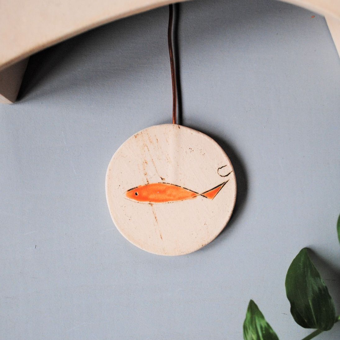 Ceramic wall clock with pendulum "Fish"