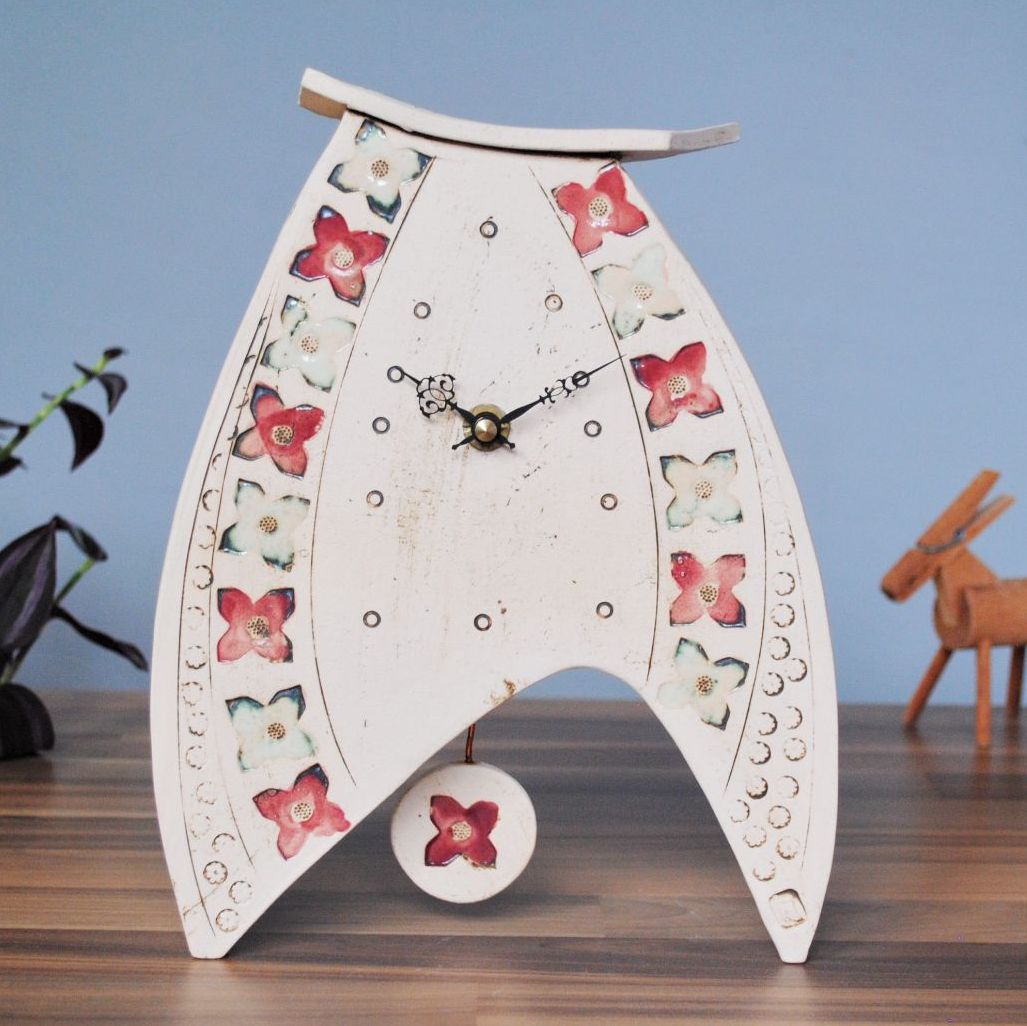 Handmade mantel clock with pendulum.