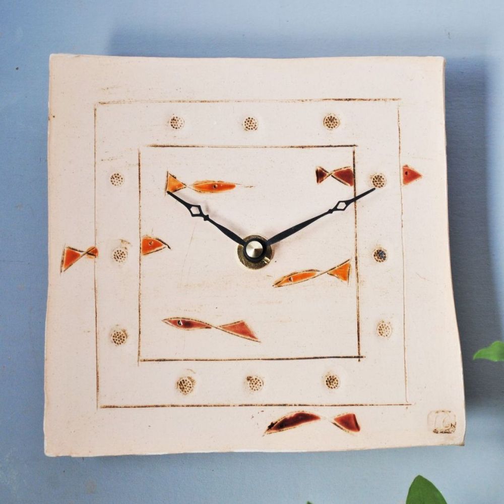 Ceramic square wall clock handmade from white clay with fish