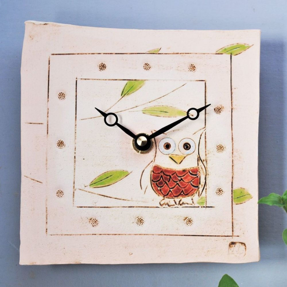 Handmade ceramic square wall clock with owl motif.