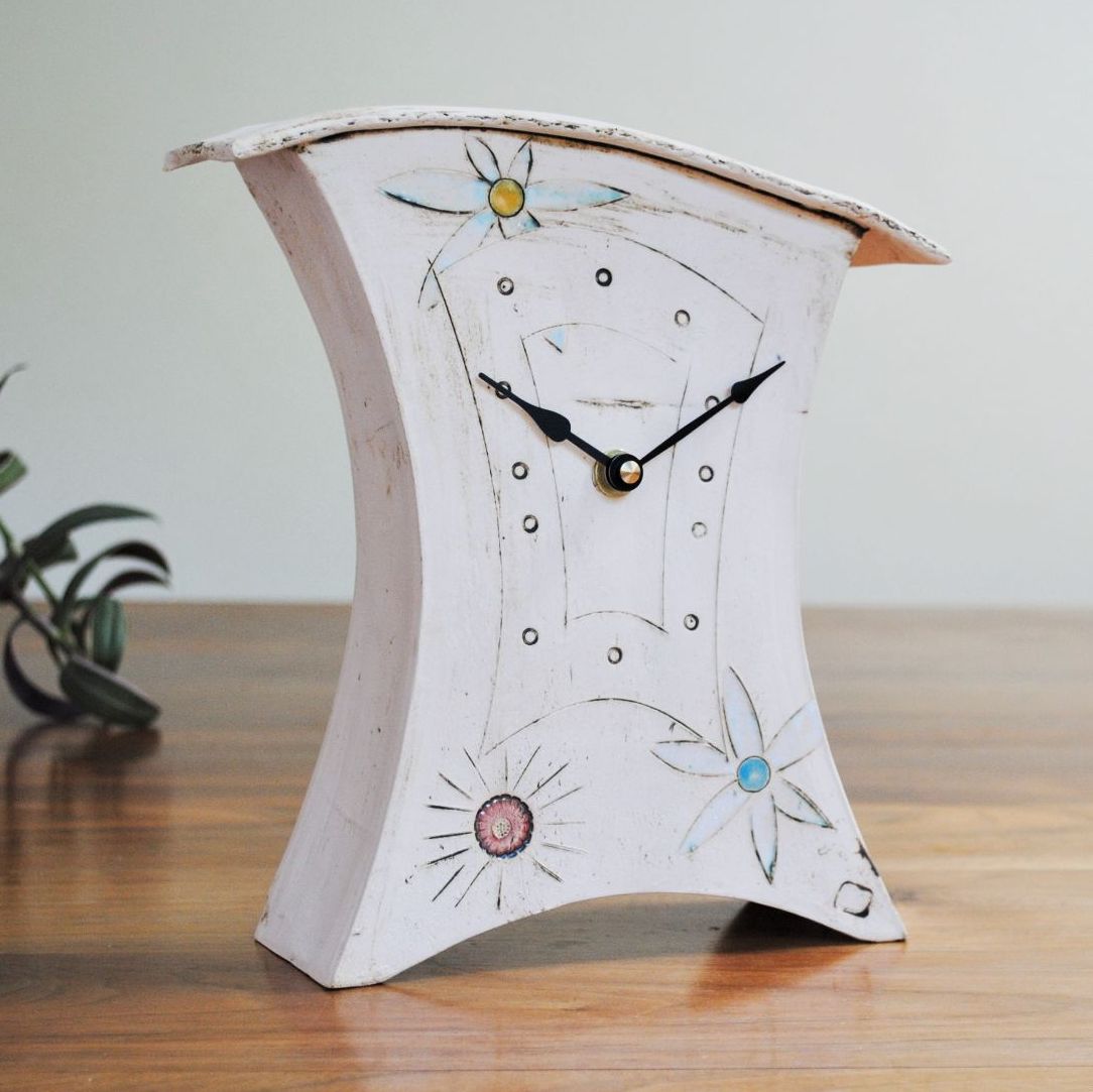 Handmade clock with flower design.