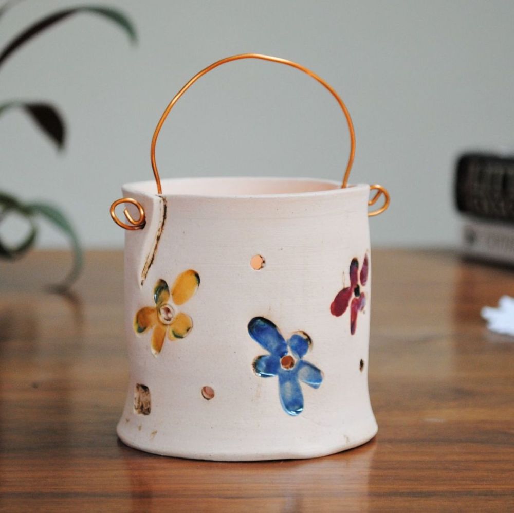 Tea light holder with floral print.