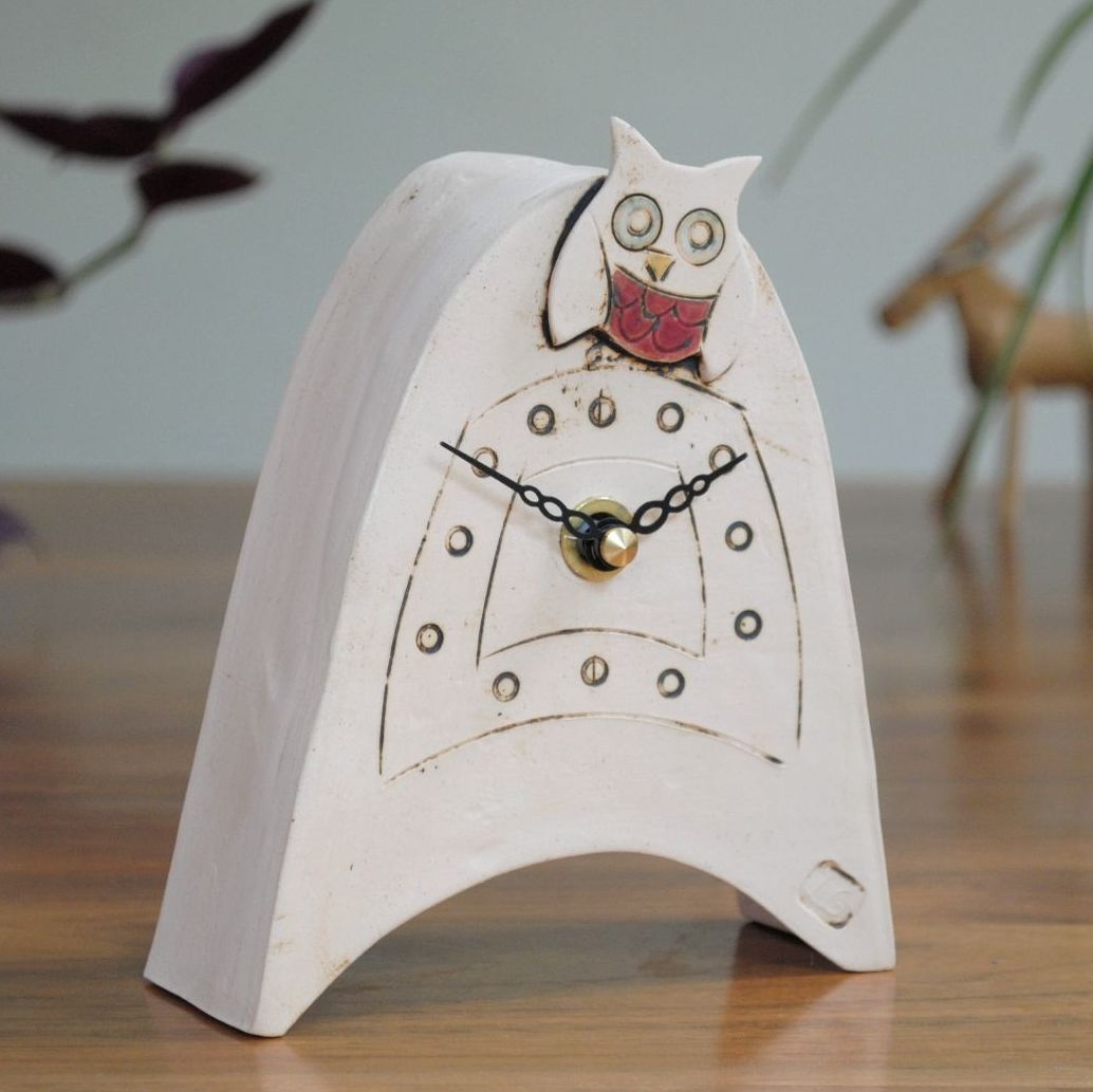 Owl clock made from off-white clay.