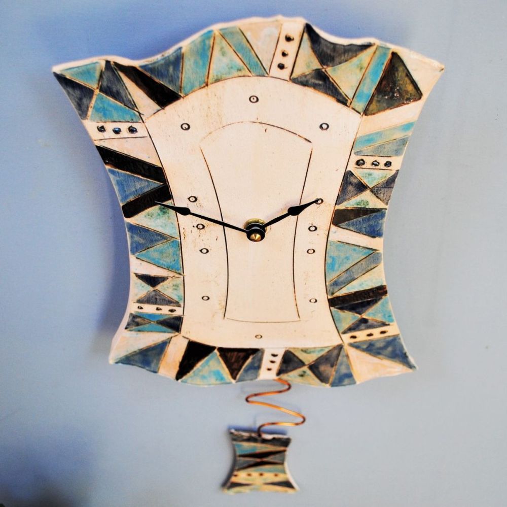 Ceramic pendulum wall clock "Geometrical blue pattern."
