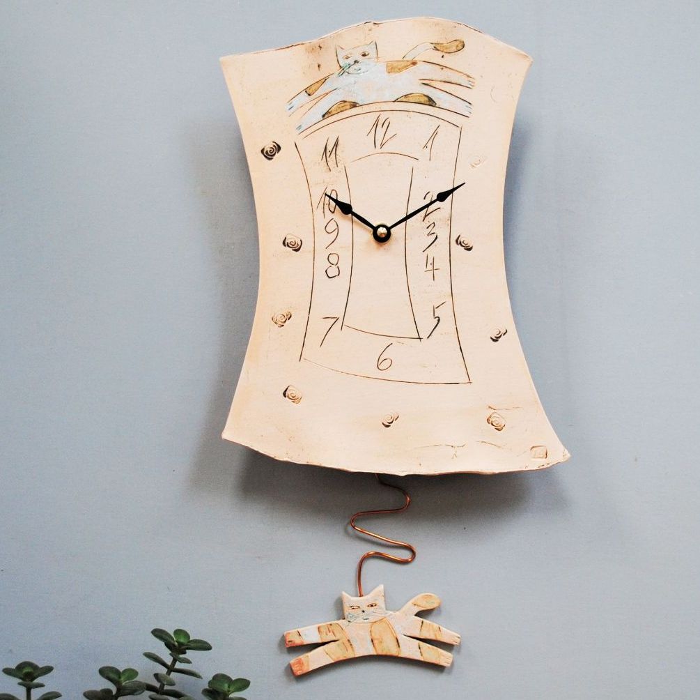 Handmade pendulum wall clock with cat.