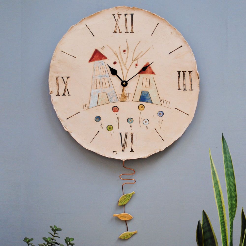 Oversized round wall clock from white clay with houses, tree and flowers de