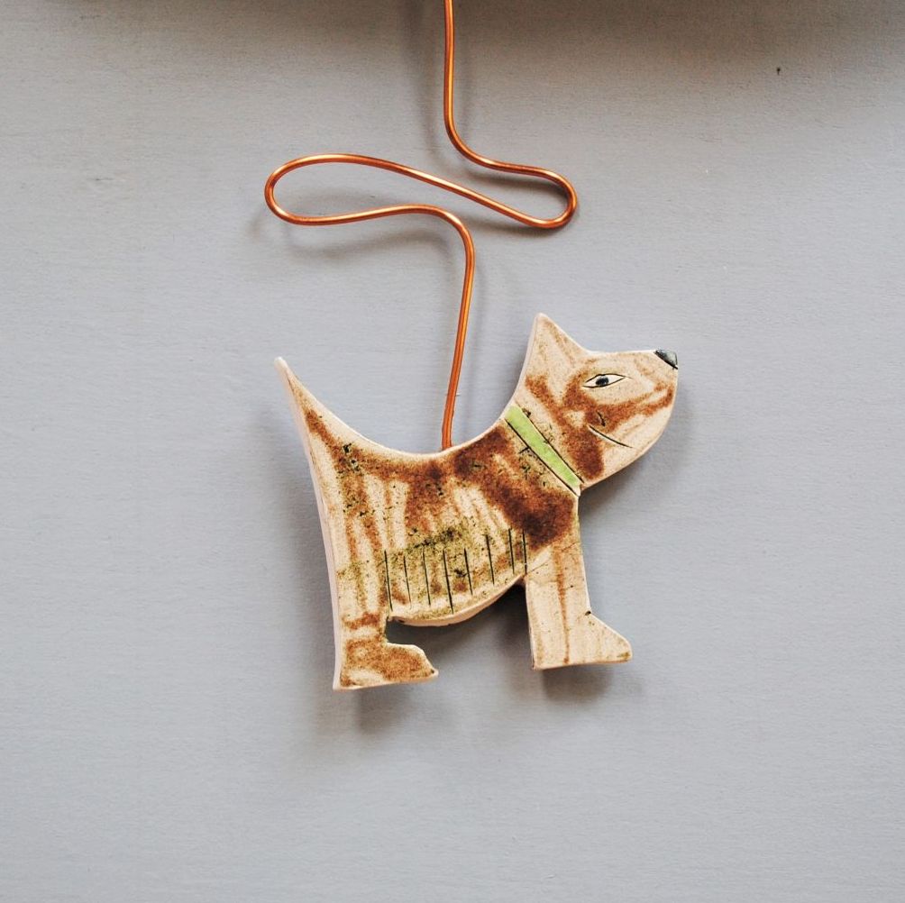 Ceramic pendulum wall clock "Brown dog"