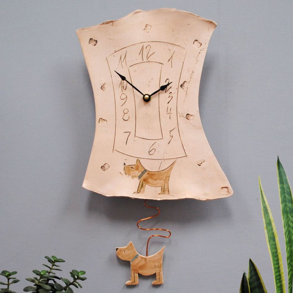 Dog wall clock in off-white clay.