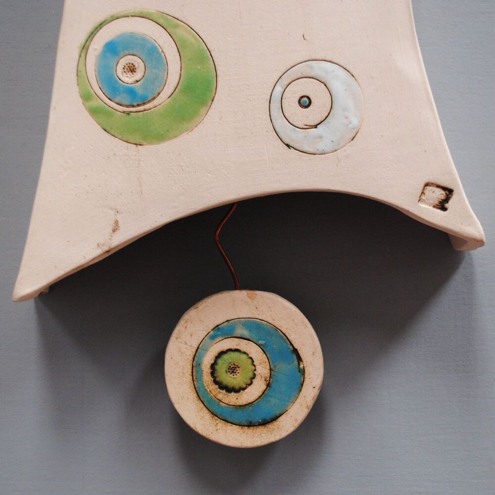 Ceramic wall clock with pendulum "Circles"