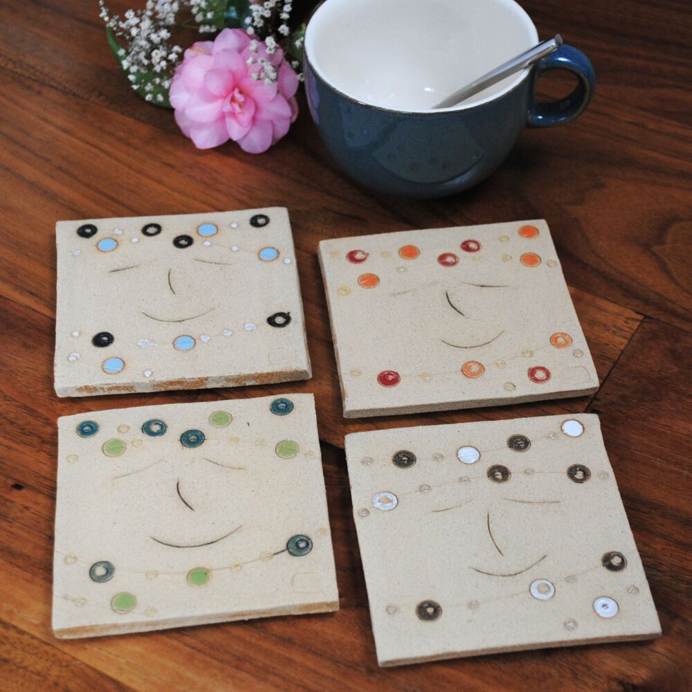 Colourful dots and smiley face coaster.
