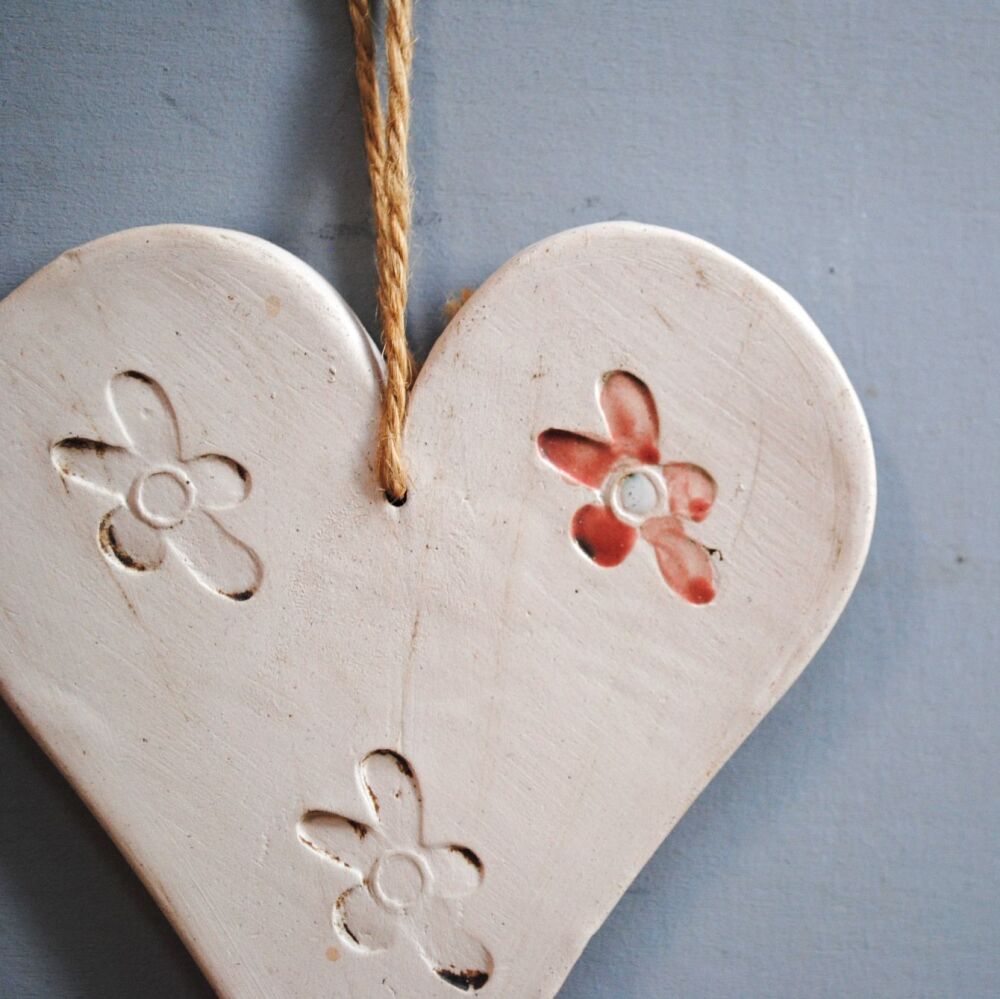 Ceramic hanging heart and flower.