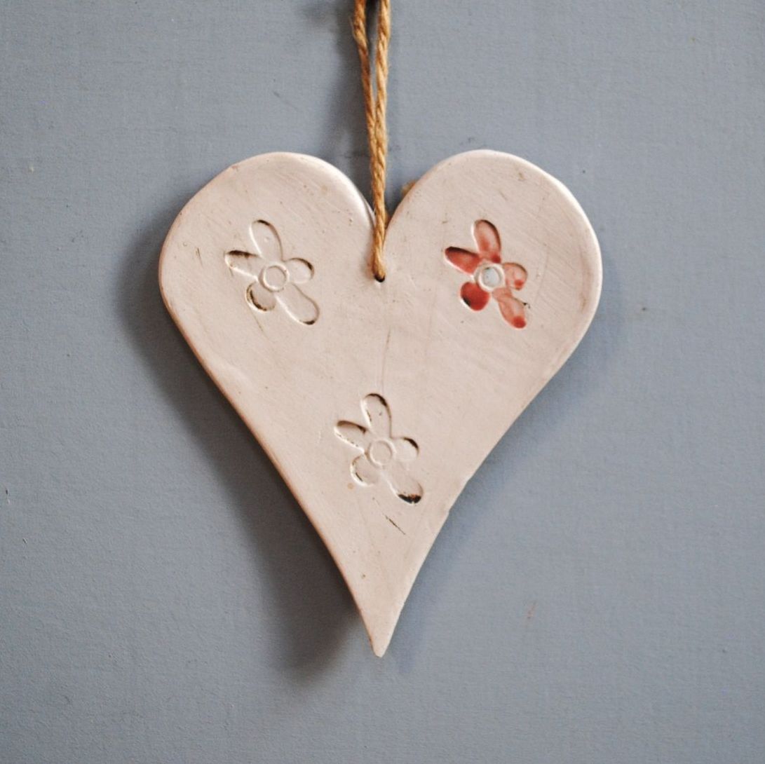 Ceramic hanging heart and flower.