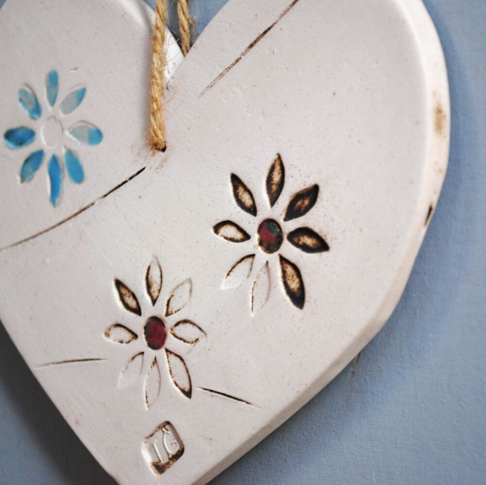 Ceramic hanging heart and blue flower.