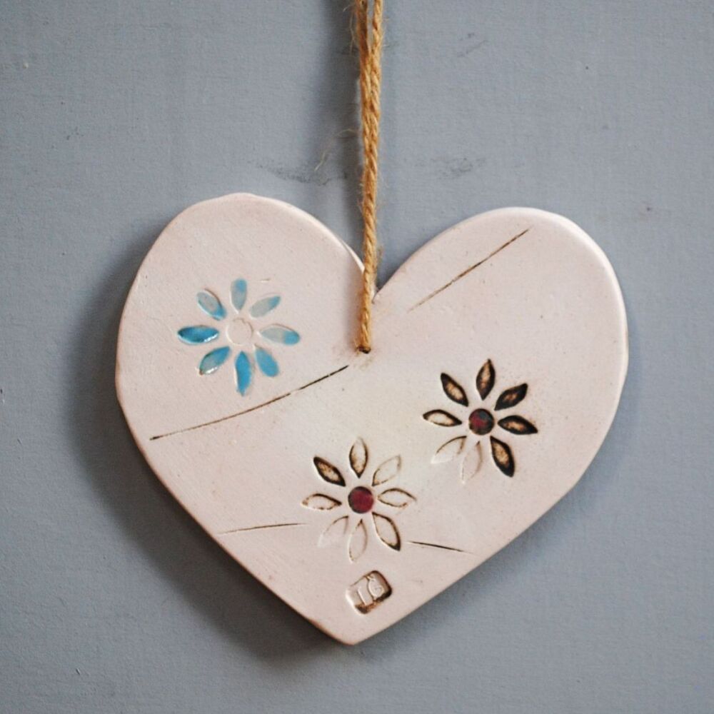 Ceramic hanging heart and blue flower.