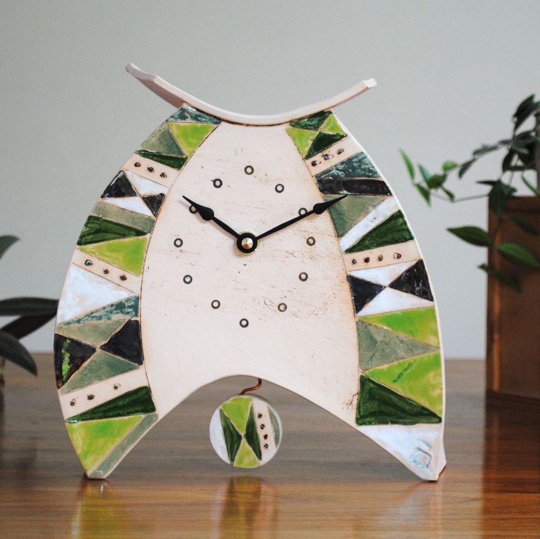 Contemporary handmade clock in green triangle design. 