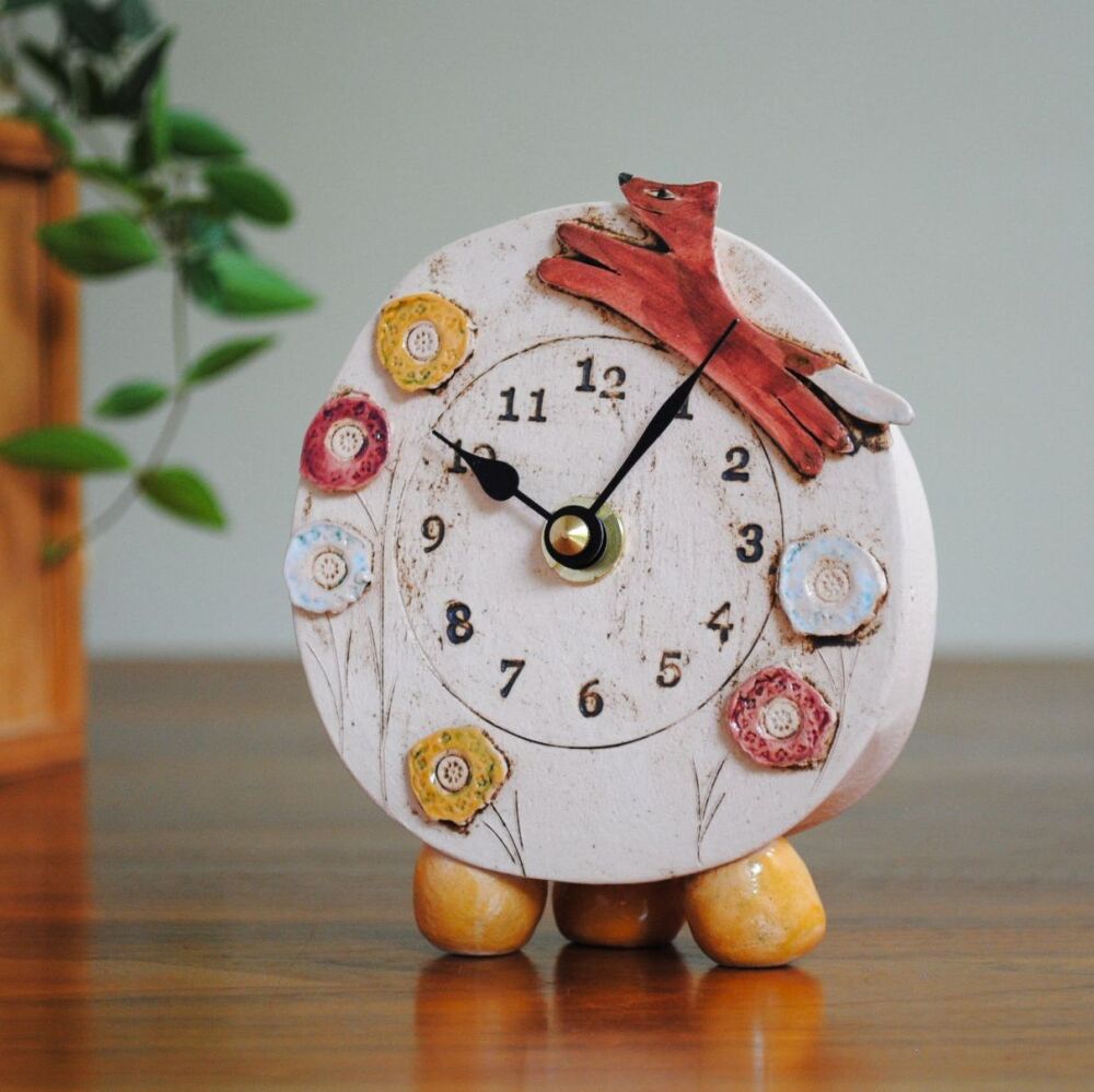 Fox ceramic mantel clock with pebble feet.