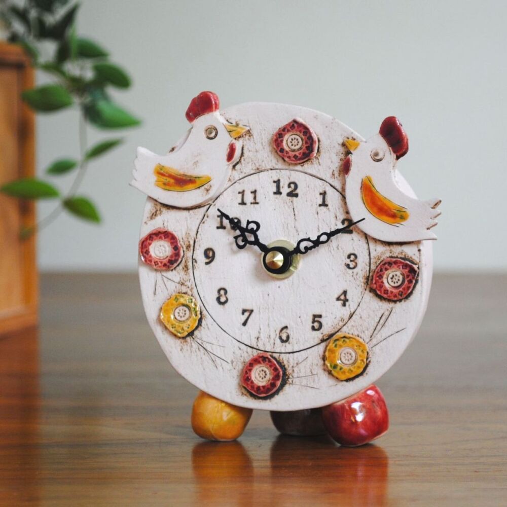 Ceramic clock pebble feet chicken  cockerel design. 