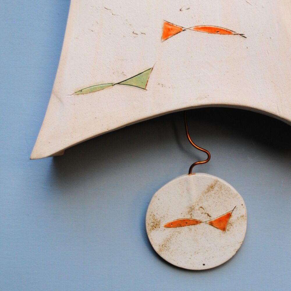 Ceramic wall clock with pendulum "Fish Shoal"