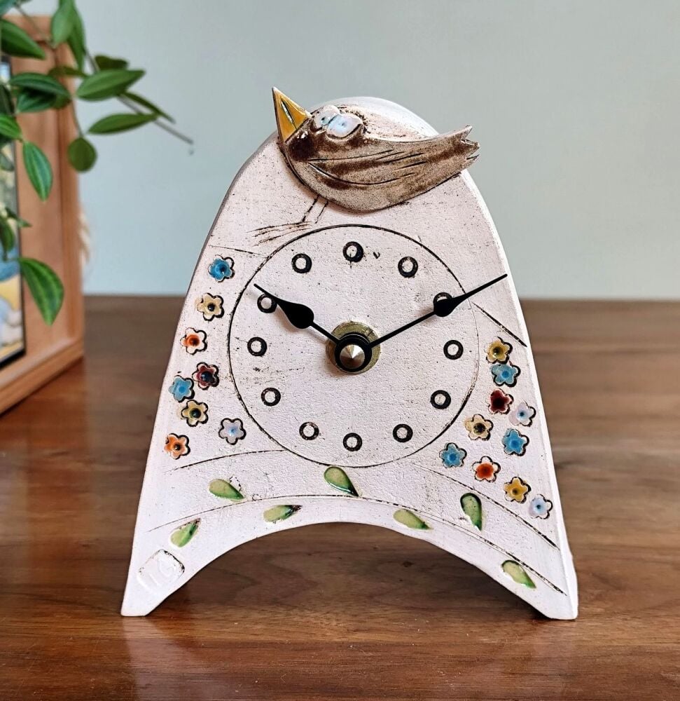 Ceramic mantel clock  small rounded "Brown bird, colourful meadow, green leaves"