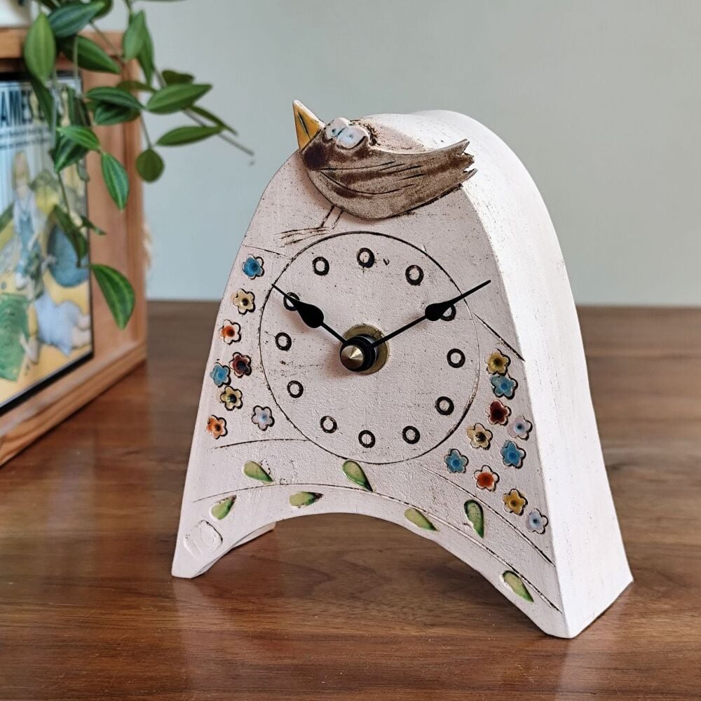 Ceramic mantel clock  small rounded "Brown bird, colourful meadow, green leaves"