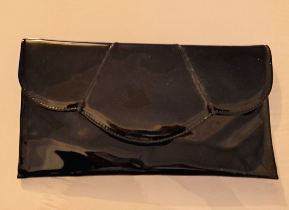 Renata black patent leather clutch. bag