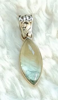 Green rutile silver pendant