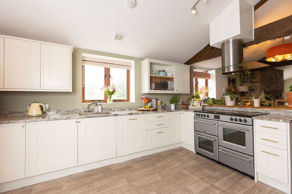 Farrow and ball painted James White kitchen with beams, wood floor in cream