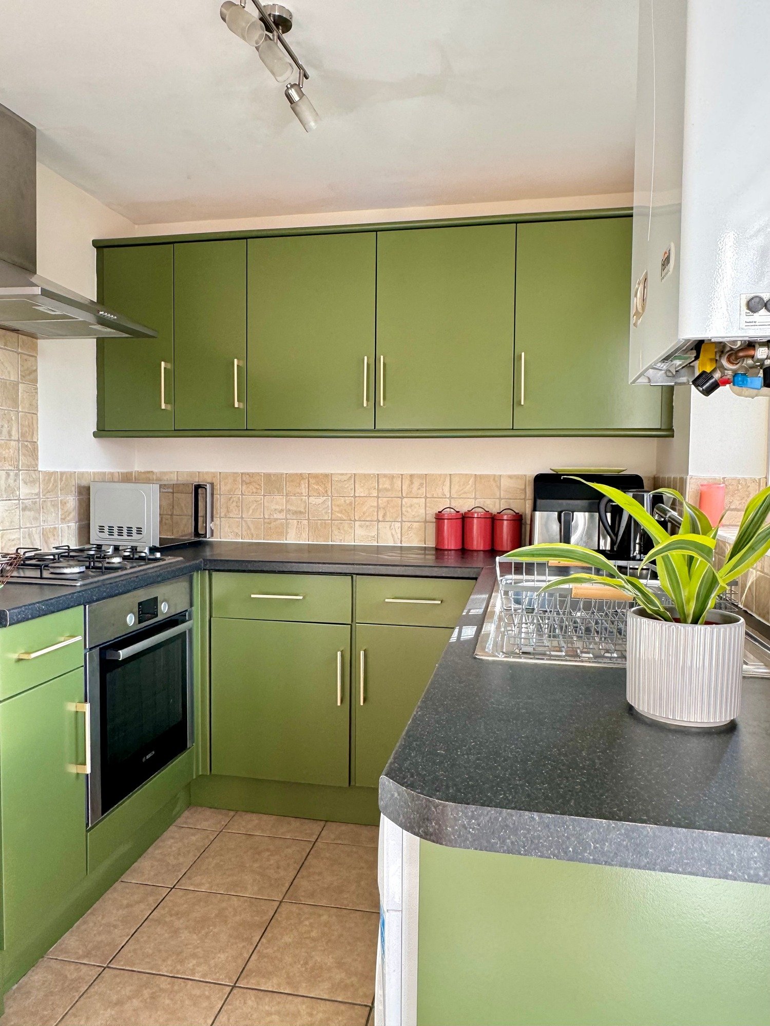 After kitchen makeover painted in green vert de terre by farrow and ball