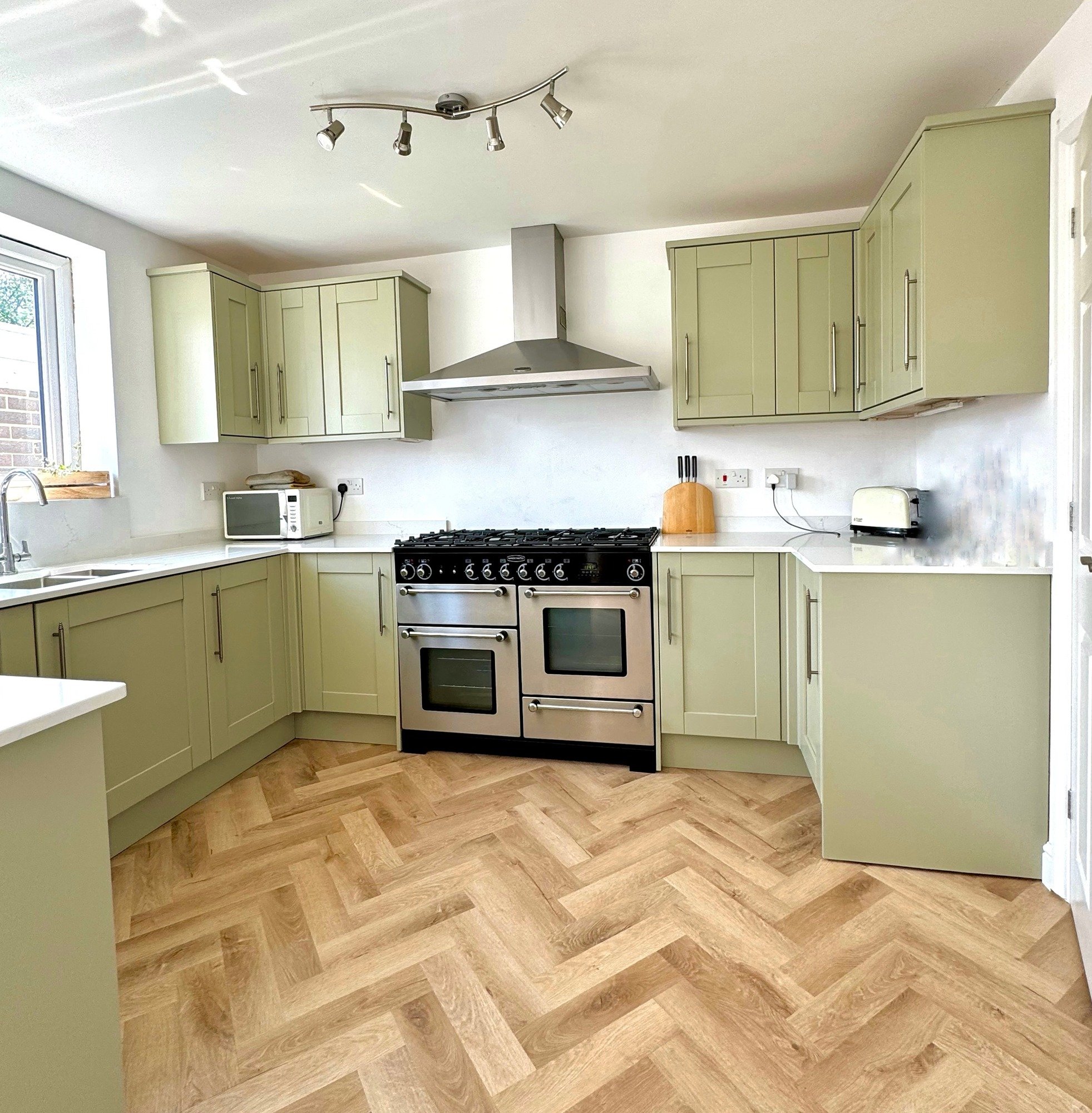 After kitchen makeover painted in green vert de terre by farrow and ball