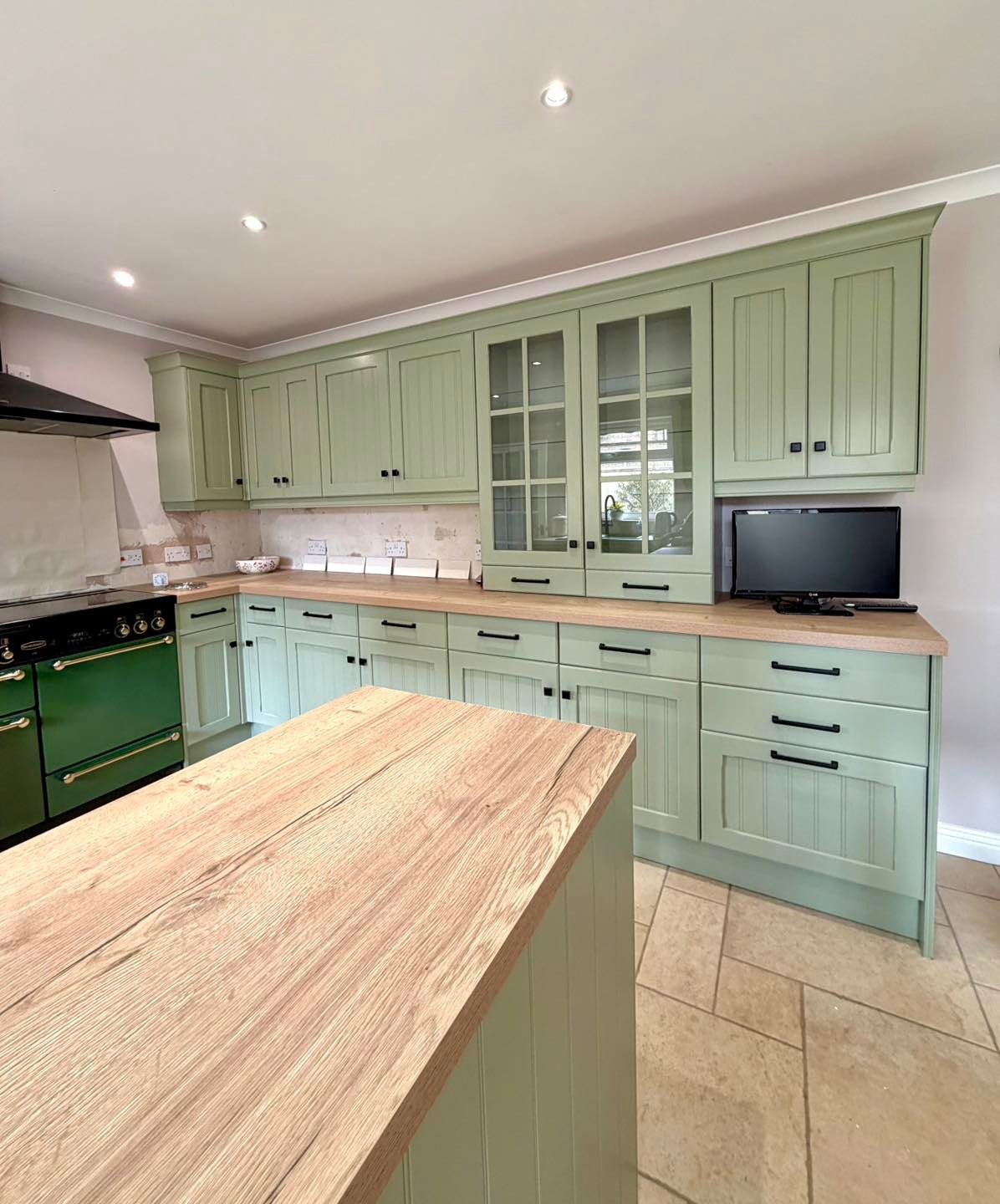 After kitchen makeover painted in green vert de terre by farrow and ball
