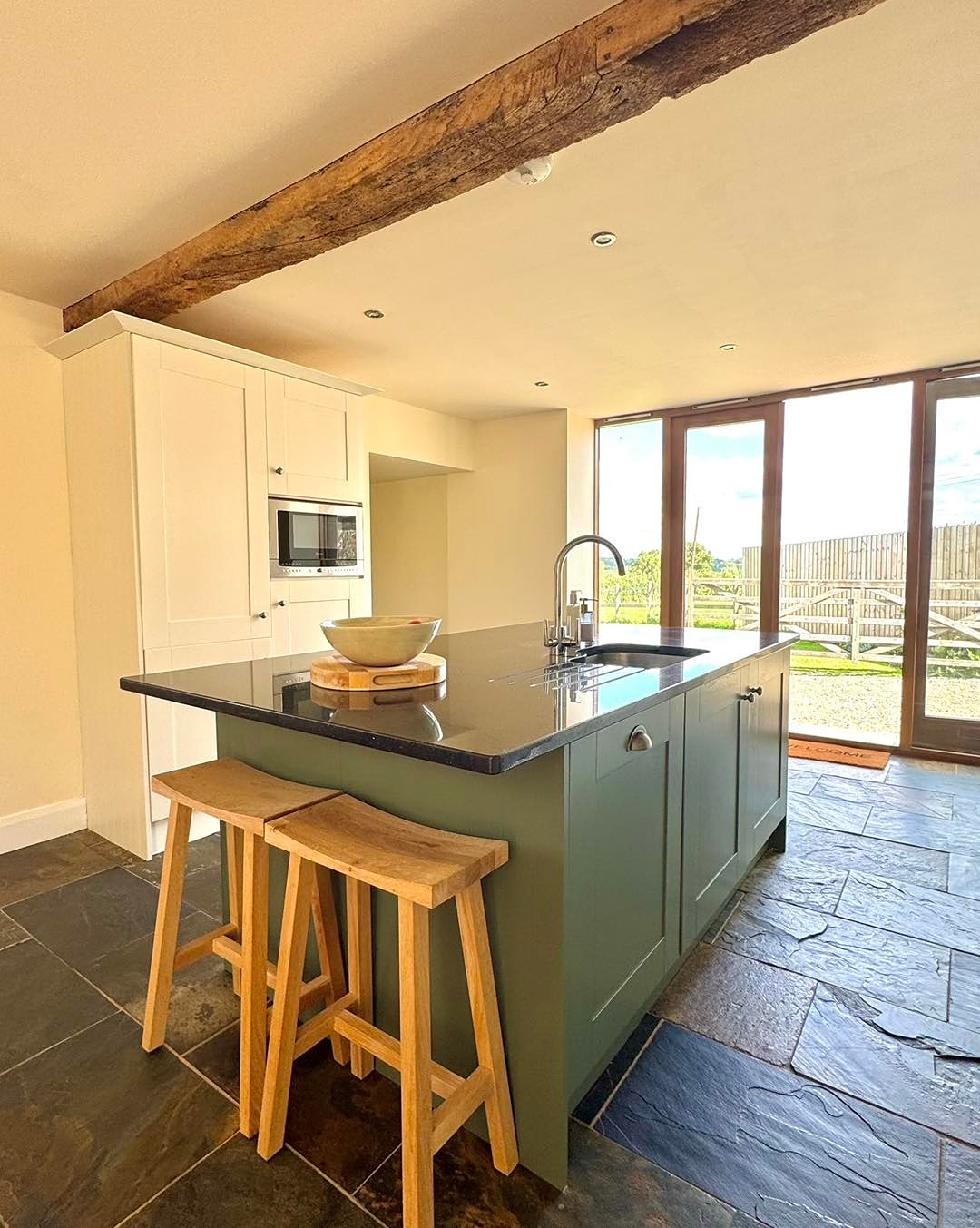 After kitchen makeover painted in green vert de terre by farrow and ball