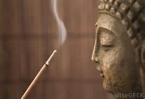 Buddha facing incense stick